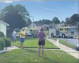  ?? COURTESY OF MICHELE CABA ?? Lorrane Berns’ family went all out to celebrate her 90th birthday with a drive-by of fire apparatus and banners at her Shillingto­n home on Tuesday. Berns (yellow shirt) and her family at the birthday drive-by.