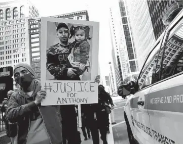  ?? CHRIS SWEDA/CHICAGO TRIBUNE ?? Edgar Meranda, cousin of Anthony Alvarez, marches with others protesting against the police in downtown Chicago on April 3. Alvarez, 22, was fatally shot by Chicago police during a foot chase.