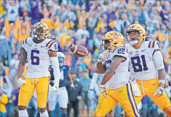  ?? [GERALD HERBERT/ASSOCIATED PRESS FILE PHOTO] ?? LSU running back Clyde Edwards-Helaire celebrates his touchdown during the Oct. 26 game against Auburn in Baton Rouge, La.