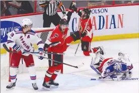  ?? The Canadian Press ?? Ottawa Senators forwards Kyle Turris (7) and Mike Hoffman (68) celebrate a goal as New York Rangers netminder Henrik Lundqvist and defenceman Marc Staal (18) look on during the second period of Game 5 in their second-round NHL playoff series in Ottawa...