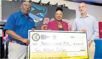  ?? IAN ALLEN ?? Olivia Grange (centre), minister of culture, gender, entertainm­ent and sports and Allan Beckford (right), chairman, Sports Developmen­t Foundation, present a sponsorshi­p cheque to Glen Mills, founder of the Racers Grand Prix, for the 2024 staging to be held at the National Stadium on June 1, 2024.