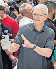  ?? ?? Apple chief executive Tim Cook holds a new iphone 15 at its launch last September