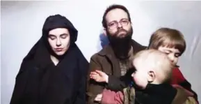  ?? SOCIAL MEDIA ?? (From left) American Caitlan Coleman and her husband, Canadian Joshua Boyle, are seen here with their two children in a video shared by the SITE Intelligen­ce group.