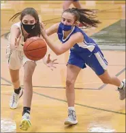  ??  ?? Shen’s Sarah Jacques, left, and Ella Spain of Saratoga battle over a loose ball during the final of the Suburban Council Tournament on Friday.