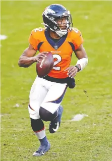  ?? MATTHEW STOCKMAN/ GETTY IMAGES ?? Kendall Hinton hasn't played quarterbac­k since college, but started a game for Denver because of COVID-19.