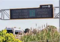  ?? BOB TYMCZYSZYN TORSTAR ?? A reminder to tested is displayed on a sign over the QEW Niagara-bound just before the 406 off-ramp.