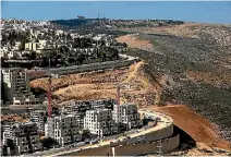  ?? PHOTOS: REUTERS ?? Nickolay Mladenov, United Nations special co-ordinator for the Middle East peace process, says Israel is continuing to expand settlement­s such as Ramot, near Jerusalem.