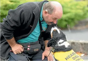  ??  ?? Tokoroa’s Roger Drower and his hearing dog, Harper.