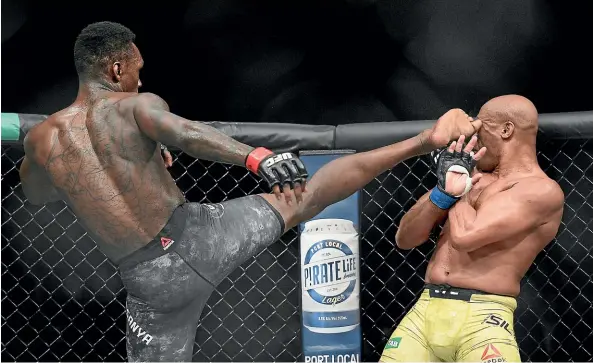  ?? AP ?? Israel Adesanya kicks Anderson Silva during their middleweig­ht bout at UFC 234 in Melbourne yesterday.