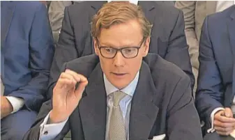  ?? PA VIA AP ?? Alexander Nix, former CEO of Cambridge Analytica, clashed with British lawmakers on Wednesday in London, denying his now- defunct firm was unethical.