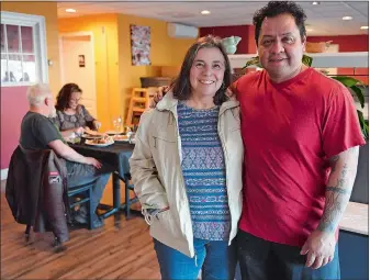  ?? SARAH GORDON/THE DAY ?? Business partners Jan Loomis, left, and her son-in-law, Martin Zavala, pose for a photo at Zavala Mexican Bistro in East Lyme.