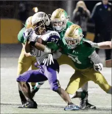  ??  ?? ABOVE: YUMA CATHOLIC’S DEFENSE gang tackles Tucson-Sabino’s Daniel McAllister (27) during the third quarter of Saturday night’s game at Shadow Mountain High School in Phoenix. LEFT: Yuma Catholic quarterbac­k Gage Reese (left) eludes Tucson-Sabino’s Richie Pina during the second quarter of Saturday night’s game in Phoenix.