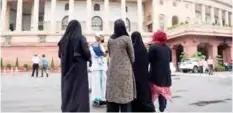  ??  ?? NEW DELHI: Muslim women visit the Parliament house to watch the current session from viewer’s gallery in New Delhi. — AFP