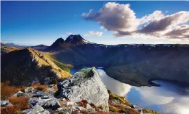  ?? Photograph: Auscape/UIG/Getty Images/Universal Images Group ?? Tasmania’s Cradle Mountain is one of the locations featured in a $9m government tourism campaign. Simon Birmingham says internatio­nal borders will not be open soon and Australian­s should spend more at home.