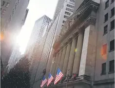  ?? — Reuters photo ?? US flags hang at the New York Stock Exchange in Manhattan, New York City.