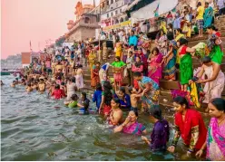 ?? IMAGES © SHUTTERSTO­CK ?? Devotees bathe in the Ganges at Varanasi, India