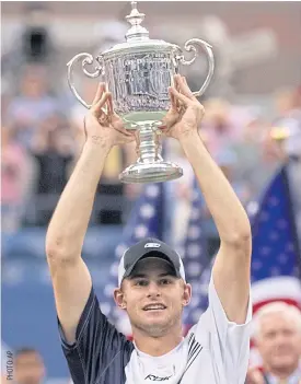  ??  ?? Andy Roddick holds the trophy after his 2003 US Open triumph.