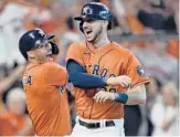  ?? DAVID J. PHILLIP/AP ?? Astros’ Kyle Tucker, right, celebrates his two-run homer against the White Sox with Carlos Correa in Game 2 of the ALDS on Friday in Houston.