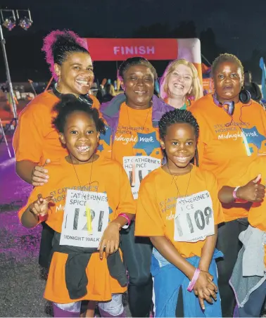  ??  ?? Some of the fundraiser­s who took part in last year’s Midnight Walk in aid of St Caterine’s. This year’s event, due to be held in June, has been postponed. Inset: Chief executive Claire Irving