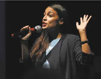  ??  ?? Ocasio-Cortez beat a 10-term Democratic representa­tive in her New York City primary, shocking many political observers. She is attracting young voters with her approach.