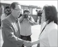  ?? KOREAN CENTRAL NEWS AGENCY VIA AFP ?? Wu Dawei (left), China’s special envoy for Korean Peninsula affairs, is greeted by a DPRK official at Pyongyang airport. Wu is China’s chief negotiator to the Six-Party Talks, aimed at ending the DPRK’s nuclear program.