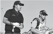  ?? DONALD MIRALLE/GETTY ?? Phil Mickelson walks with his caddie during the third round of the Desert Classic at the Stadium Course on Saturday.