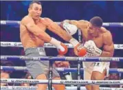  ?? AFP ?? Anthony Joshua (right) throws a punch at Wladimir Klitschko