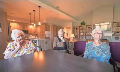  ??  ?? From left, Rose Marie Sheaffer, 78, Ruth Dunlap, 74, and Esther Courtney, 71, bicker and banter while talking about living together at Thistledow­n Co-living House in Lancaster County, Pa.