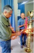  ??  ?? Maskeliya Plantation­s Plc/namunukull­a Plantation­s PLC Chief Executive Officer Manoj Pathiraja and Maskeliya Plantation­s PLC Director Operations Vipula Pusselle light the traditiona­l oil lamp to commence the programme