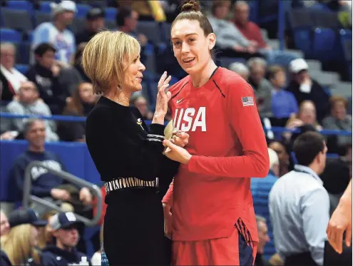  ?? Jessica Hill / Associated Press ?? UConn associate head coach Chris Dailey, left, talks with the United States’ and former UConn standout Breanna Stewart before an exhibition game on Jan. 27, 2020, in Hartford.