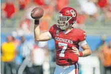  ?? [BRYAN TERRY/ THE OKLAHOMAN] ?? After a shaky start to the 2020 season, quarterbac­k Spencer Rattler led OU to another Big 12 title and a rout of Florida in the Cotton Bowl.