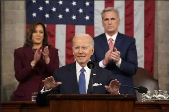  ?? JACQUELYN MARTIN — THE ASSOCIATED PRESS ?? President Joe Biden delivers the State of the Union address to a joint session of Congress at the U.S. Capitol on Tuesday in Washington as Vice President Kamala Harris, left, and House Speaker Kevin Mccarthy of Calif., applaud.