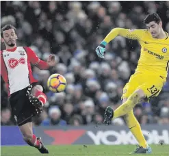  ??  ?? Winning way: Thibaut Courtois clears his lines against Southampto­n as Marco Gabbiadini closes in