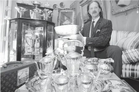  ??  ?? Lunds’ Peter Boyle, with some of the items in the Ross estate sale. The silver category has the highest number of lots, at 113. “There is a lot of Georgian and Victorian silver,” Boyle says.