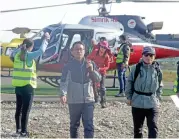  ?? (AFP) ?? Rescued trekkers arrive from the Annapurna circuit, at the airport of Pokhara, some 200km west of Kathmandu, on Saturday