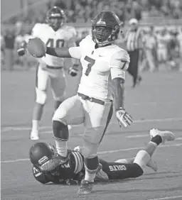  ??  ?? Centennial's Tawee Walker (7) stiff-arms Casteel's Casen Simonton (21) on his way to a touchdown during the first half at Casteel High School in Queen Creek on Aug. 17.