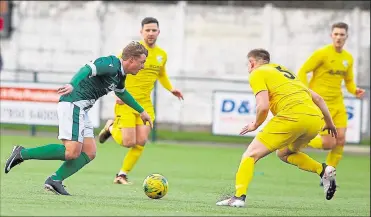  ?? Pictures: Andy Jones FM30454581, left; FM30454570, right ?? Left, George Purcell drives forward against Chichester on Saturday. Right,
Tommie Fagg congratula­ted after scoring United’s first goal in Saturday’s match.