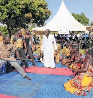  ?? AP PHOTO ?? Former child soldiers of the Lord’s Resistance Army (LRA) and community members take part in a theater performanc­e depicting rebel violence against the local communitie­s in Gulu, Uganda.