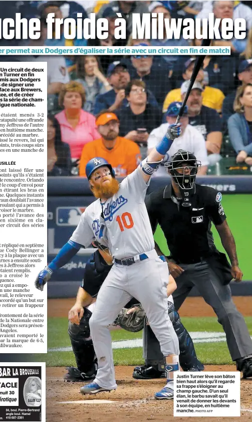  ?? PHOTO AFP ?? Justin Turner lève son bâton bien haut alors qu’il regarde sa frappe s’éloigner au champ gauche. D’un seul élan, le barbu savait qu’il venait de donner les devants à son équipe, en huitième manche.