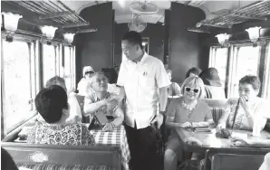  ??  ?? PETER beramah mesra dengan para penumpang dari luar negara.