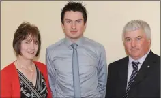  ??  ?? Brian White of Cooley Kickhams, Senior Football award winner at the Louth GAA Supporters’ Club presentati­on dance in The Fairways Hotel, with parents, Rose and Laurence.