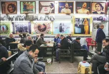  ?? SABAH ARAR / AGENCE FRANCE-PRESSE ?? Iraqi men gather and socialize at Umm Kulthum Cafe on Rasheed street, the oldest street in Baghdad, on Jan 20.