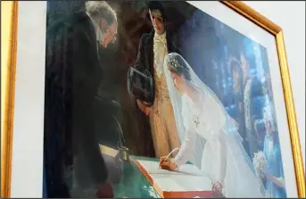  ??  ?? Out: The tender portrait of bride and groom signing the register