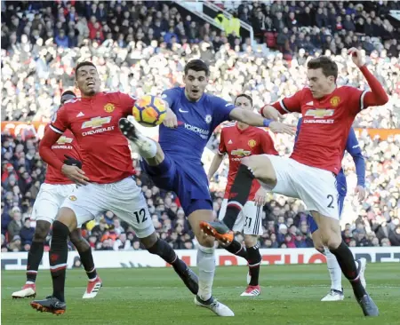  ??  ?? Players of Chelsea and Manchester United vie for the ball in this file photo. Chelsea play Man U in an English Premier League match on Saturday.