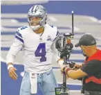 ?? RON JENKINS ASSOCIATED PRESS FILE PHOTO ?? Cowboys quarterbac­k Dak Prescott is the first player in NFL history with at least 450 yards passing in three straight games, but mostly because the Cowboys (1-3) faced double-digit deficits in the second half.