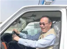  ?? — AFP ?? Ambassador Fumio Iwai rides in a pickup truck during a handover ceremony of vehicles provided by Japan to the Iraqi police in this file photo.