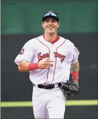 ?? Portland Press Herald via Getty ?? Jarren Durran of the Sea Dogs is all smiles as he jogs from center field against the Richmond Flying Squirrels in 2019.