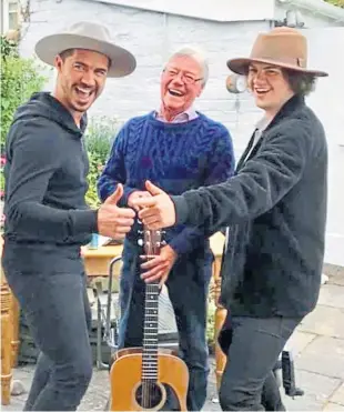  ??  ?? Joe McKay enjoyed performing music and also mentored young, upcoming musicians. He is pictured here with nephews Sam and Joel.