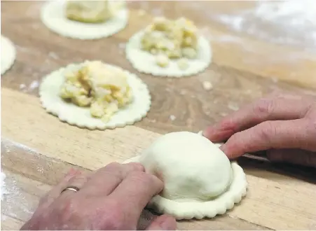  ??  ?? Stan’s Northfield Bakery, which sells handmade perogies in Northfield, Ohio, says the shop increases production of the potato-filled dumplings tenfold in December.