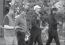  ?? ERIC RISBERG/AP PHOTO ?? From left, golfers Kevin Streelman, Jerry Kelly, and NFL players Aaron Rodgers and Larry Fitzgerald make their way down the first fairway of the Spyglass Hill Golf Course during the first round of the AT&T Pebble Beach National Pro-Am on Thursday at...